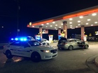 Group Wearing Halloween Masks Shoots Woman